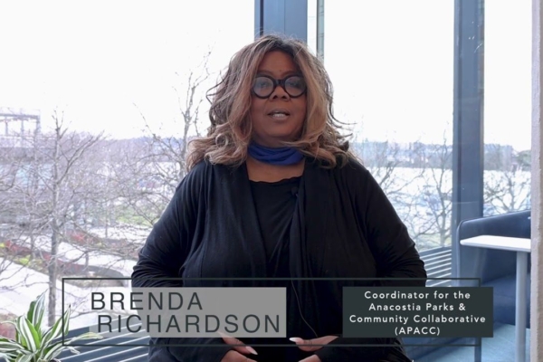 Image of Brenda Richardson, a lady sitting in a chair wearing black